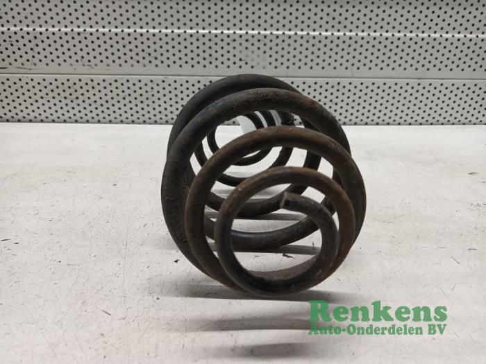 Rear coil spring from a Opel Kadett E (33/34/43/44) 1.2 S,LS 1986
