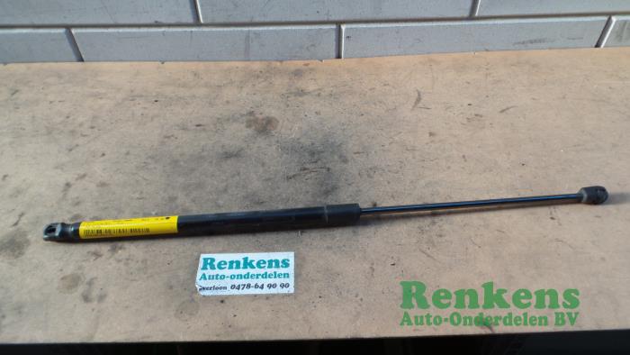Rear gas strut, right from a Opel Corsa D 1.4 16V Twinport 2008