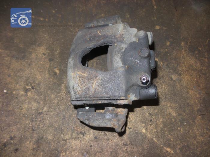 Front brake calliper, left from a Opel Corsa B (73/78/79) 1.5TD Swing,Joy,Sport,GLS 2000