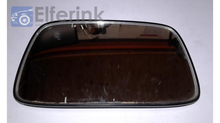 Mirror glass, left from a Volvo 4-Serie 1993