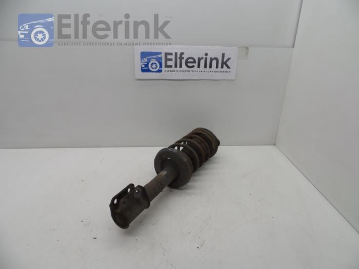 Front shock absorber rod, left from a Opel Corsa B (73/78/79) 1.2i City,Swing 1996