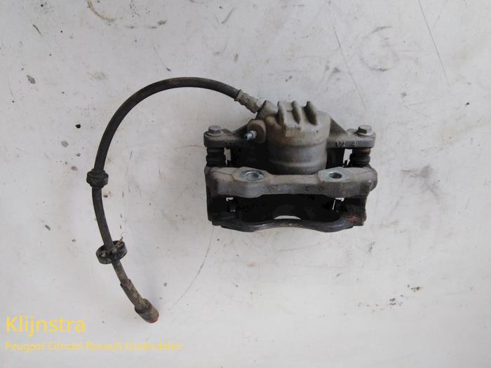 Front brake calliper, left from a Peugeot 208 2013