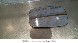 Used Mirror glass, left Renault Scénic II (JM) 1.9 dCi 115 Price on request offered by Autodemontage M.J. Rutte B.V.
