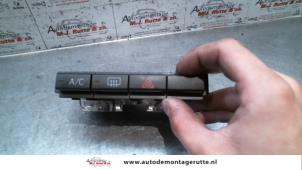 Used Rear window heating switch Daihatsu Cuore (L251/271/276) 1.0 12V DVVT Price on request offered by Autodemontage M.J. Rutte B.V.