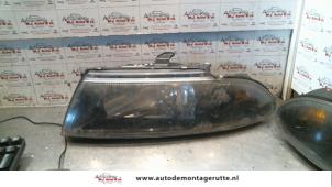 Used Headlight, left Mitsubishi Carisma 1.6i 16V Price on request offered by Autodemontage M.J. Rutte B.V.