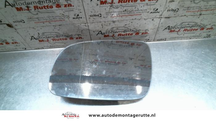 Mirror glass, left from a Seat Arosa (6H1) 1.4i 2002
