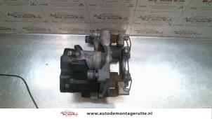 Used Rear brake calliper, left Volkswagen Golf VII (AUA) 1.2 TSI 16V Price on request offered by Autodemontage M.J. Rutte B.V.