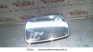 Used Mirror glass, right Toyota Corolla (EB/WZ/CD) 1.9 D Price on request offered by Autodemontage M.J. Rutte B.V.