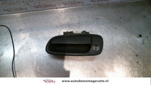 Used Door handle 4-door, front left Toyota Carina E (T19) 1.6i 16V Price on request offered by Autodemontage M.J. Rutte B.V.