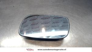 Usados Cristal reflectante izquierda Opel Astra F (56/57) 1.6i Precio de solicitud ofrecido por Autodemontage M.J. Rutte B.V.