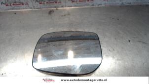 Used Mirror glass, left Toyota Yaris II (P9) 1.0 12V VVT-i Price on request offered by Autodemontage M.J. Rutte B.V.