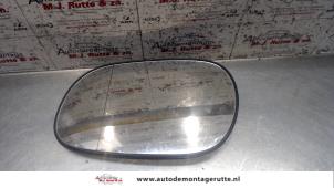 Used Mirror glass, left Mitsubishi Carisma 1.6i 16V Price on request offered by Autodemontage M.J. Rutte B.V.