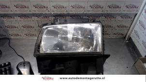 Used Headlight, left Volkswagen Transporter/Caravelle T4 2.5 TDI Price on request offered by Autodemontage M.J. Rutte B.V.