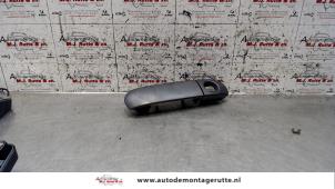 Used Rear door handle 4-door, right Mitsubishi Colt (Z2/Z3) 1.3 16V Price on request offered by Autodemontage M.J. Rutte B.V.