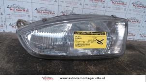 Used Headlight, left Mitsubishi Colt (CJ) 1.3 GL,GLX 12V Price € 25,00 Margin scheme offered by Autodemontage M.J. Rutte B.V.