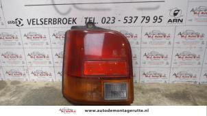 Used Taillight, left Daihatsu Cuore (L251/271/276) 850,Domino Price on request offered by Autodemontage M.J. Rutte B.V.