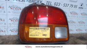 Used Taillight, left Daihatsu Cuore (L251/271/276) 850 Price on request offered by Autodemontage M.J. Rutte B.V.
