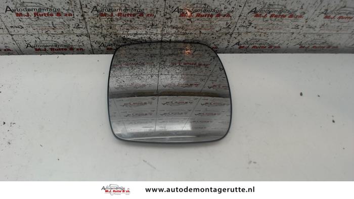 Mirror glass, left from a Renault Kangoo Express (FW) 1.5 dCi 90 FAP 2010