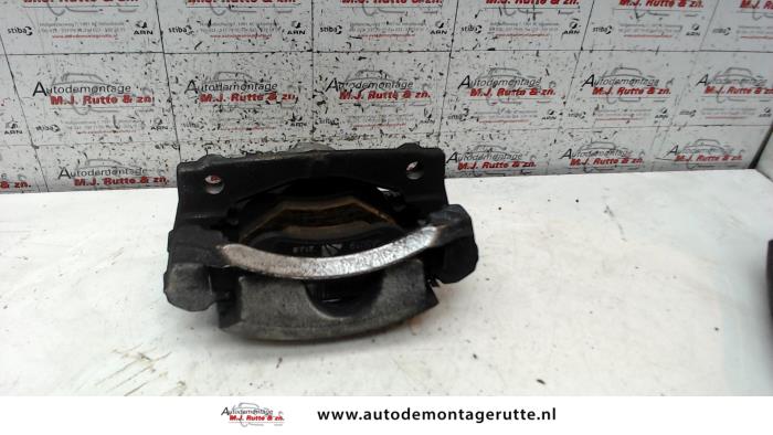 Front brake calliper, left from a Peugeot 108 1.0 12V 2014