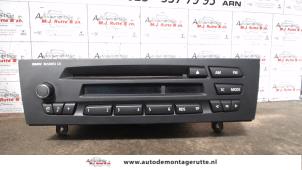 Used Radio BMW 1 serie (E81) 118i 16V Price on request offered by Autodemontage M.J. Rutte B.V.