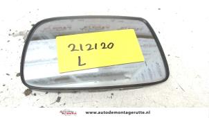 Used Mirror glass, left Toyota Yaris (P1) 1.3 16V VVT-i Price on request offered by Autodemontage M.J. Rutte B.V.
