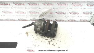 Used Front brake calliper, left Volkswagen Golf IV (1J1) 1.6 16V Price on request offered by Autodemontage M.J. Rutte B.V.