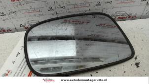 Used Mirror glass, left Suzuki Liana (ERC/ERD/RH4) 1.6 MPi 16V Price on request offered by Autodemontage M.J. Rutte B.V.