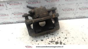 Used Front brake calliper, right BMW 1 serie (E87/87N) 118d 16V Price on request offered by Autodemontage M.J. Rutte B.V.