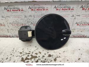 Used Tank cap cover Opel Astra H GTC (L08) 1.6 16V Twinport Price on request offered by Autodemontage M.J. Rutte B.V.