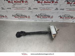 Used Rear door stop 4-door, left Nissan Note (E11) 1.4 16V LPG Price on request offered by Autodemontage M.J. Rutte B.V.
