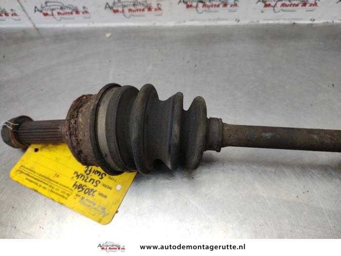 Front drive shaft, left from a Suzuki Swift (SF310/413) 1.3i 16V 2001
