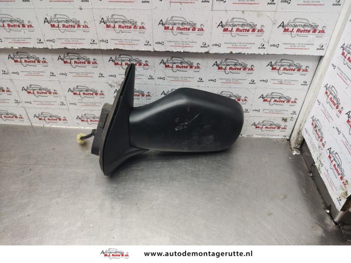 Wing mirror, left from a Subaru G3X Justy 1.3 16V AWD 2004