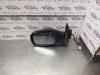 Wing mirror, left from a Subaru G3X Justy 1.3 16V AWD 2004
