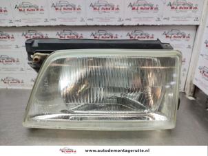 Used Headlight, left Opel Kadett E (33/34/43/44) 2.0 GSi Price on request offered by Autodemontage M.J. Rutte B.V.
