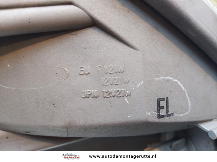 Phare gauche d'un Daihatsu Sirion 2 (M3) 1.3 16V DVVT 2005