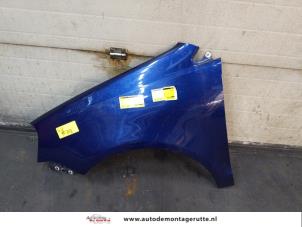 Used Front wing, left Volkswagen Polo IV (9N1/2/3) 1.4 16V 75 Price on request offered by Autodemontage M.J. Rutte B.V.