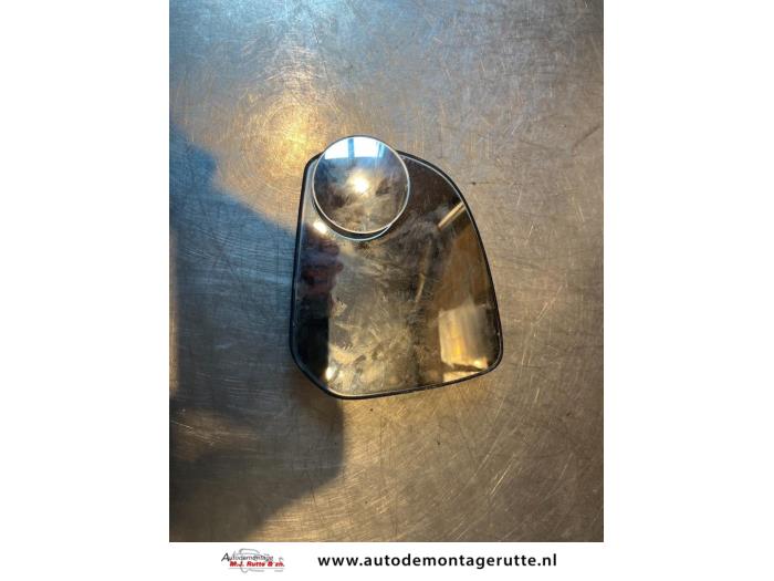 Mirror glass, left from a Nissan Pixo (D31S) 1.0 12V 2011
