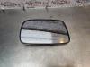Mirror glass, left from a Toyota Yaris (P1), 1999 / 2005 1.3 16V VVT-i, Hatchback, Petrol, 1.299cc, 63kW (86pk), FWD, 2NZFE; 2SZFE, 1999-08 / 2005-11, NCP10; NCP20; NCP22; SCP12 2002