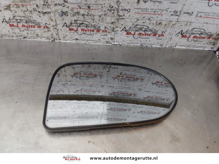 Spiegelglas rechts van een Daihatsu Cuore (L251/271/276) 1.0 12V DVVT 2005