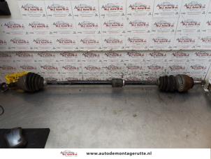 Used Front drive shaft, right Opel Astra J Sports Tourer (PD8/PE8/PF8) 1.4 16V ecoFLEX Price on request offered by Autodemontage M.J. Rutte B.V.