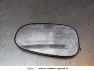Used Mirror glass, left Nissan Almera Tino (V10M) 1.8 16V Price on request offered by Autodemontage M.J. Rutte B.V.