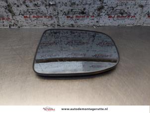 Used Mirror glass, right Daihatsu Cuore (L251/271/276) 1.0 12V DVVT Price on request offered by Autodemontage M.J. Rutte B.V.