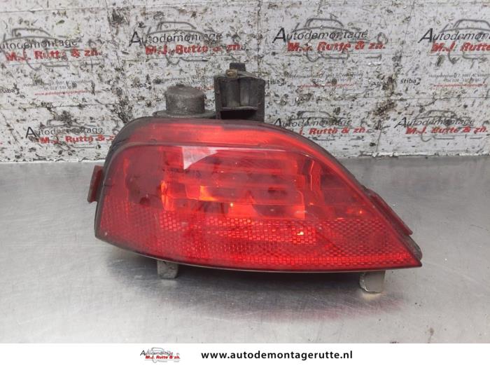 Rear fog light from a Renault Megane III Coupe (DZ) 1.4 16V TCe 130 2010