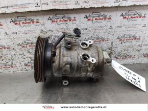 Used Air conditioning pump Nissan Pixo (D31S) 1.0 12V Price on request offered by Autodemontage M.J. Rutte B.V.