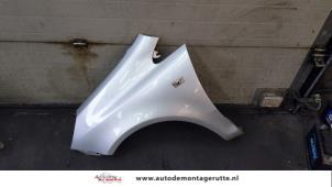 Used Front wing, left Opel Corsa D 1.2 16V Price on request offered by Autodemontage M.J. Rutte B.V.