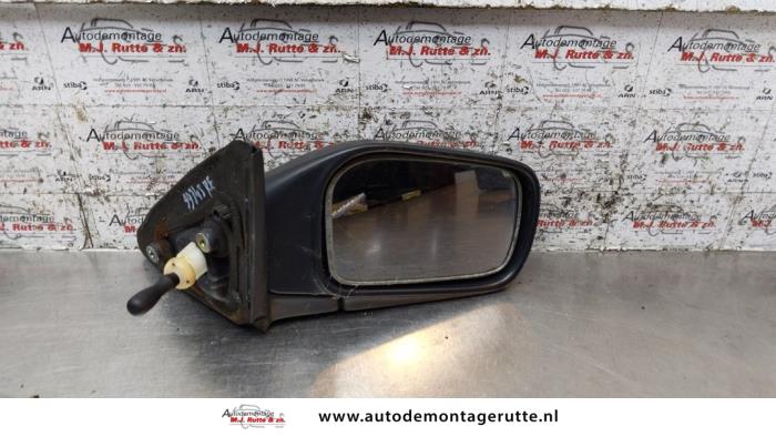 Wing mirror, right from a Nissan Sunny (N14) 1.4i 16V 1994
