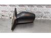 Wing mirror, left from a Nissan Sunny (N14) 1.4i 16V 1994