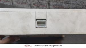 Innerdisplay från en Nissan Micra (K12) 1.2 16V 2003