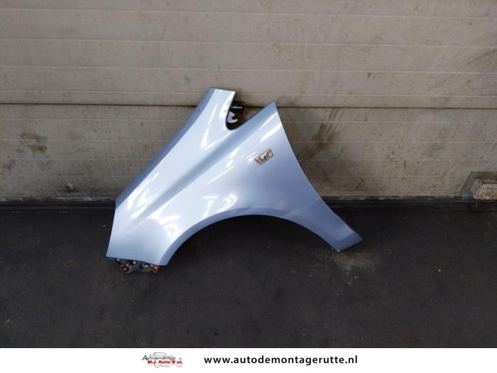 Front wing, left from a Opel Corsa D 1.2 16V 2007