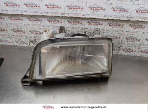 Used Headlight, left Volvo 440 1.8 i DL/GLE Price on request offered by Autodemontage M.J. Rutte B.V.